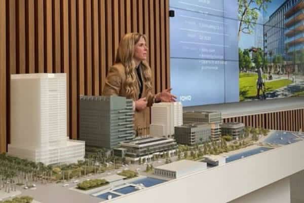 Woman giving presentation and showing scale model of Sacramento city